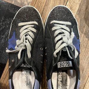 Golden Goose Black and White Superstar Sneakers